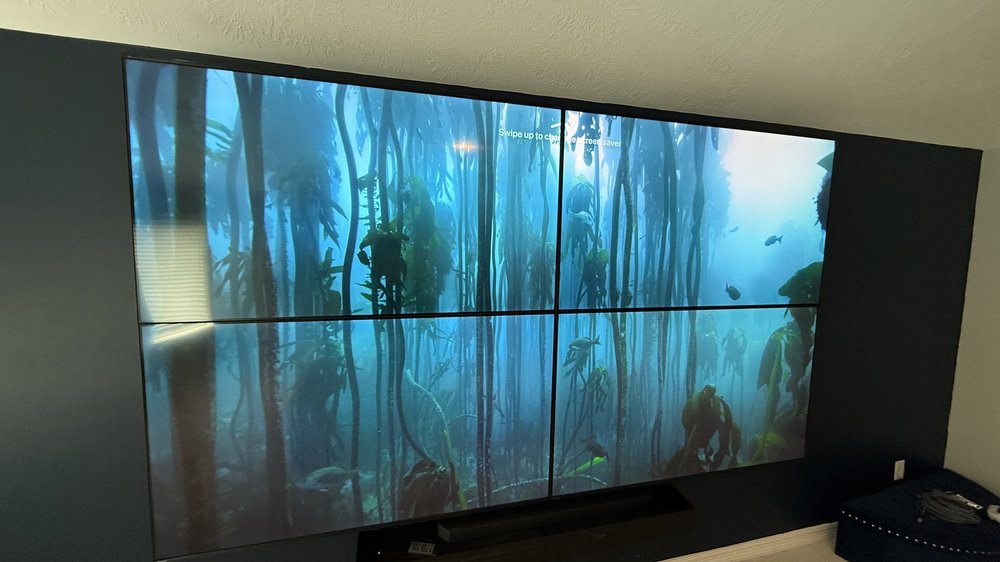 A large display assembled from multiple screens for entertainment and presentations.